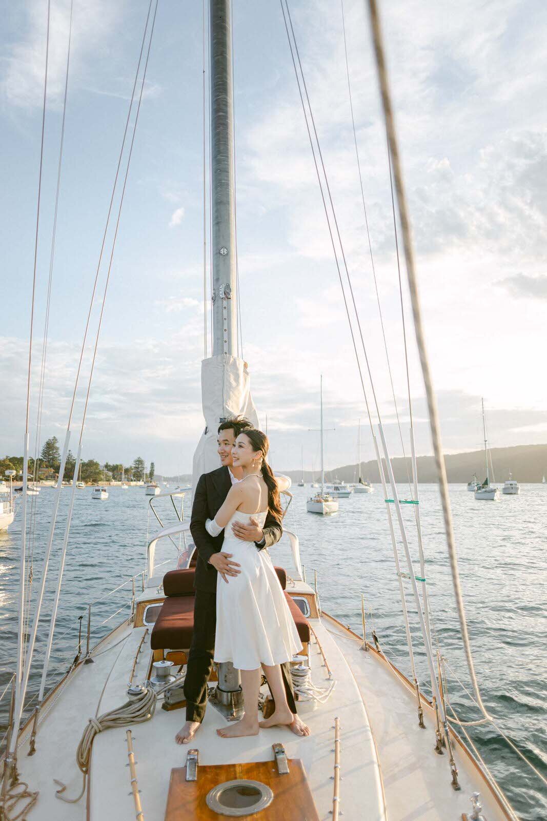 engaged couple on a sailboat in Palm Beach, Sydney