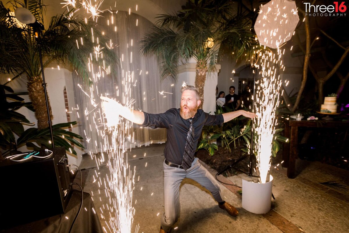 Wedding guest hams it up between sparklers
