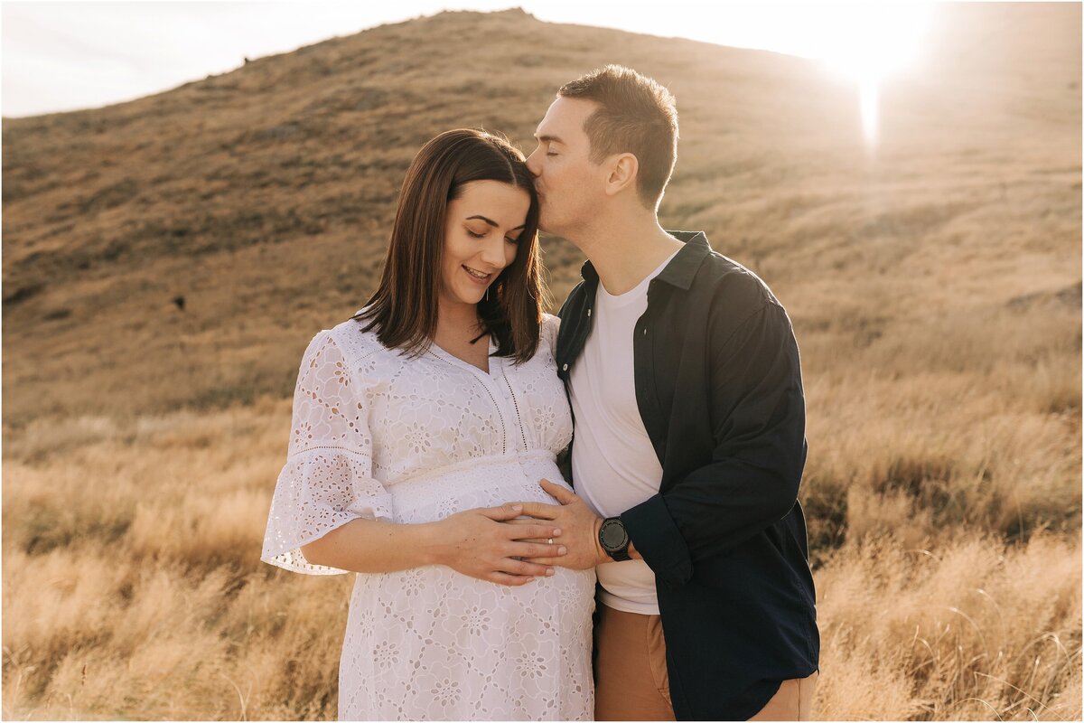 maternity location christchurch top of port hills sunset long dry grass new zealand