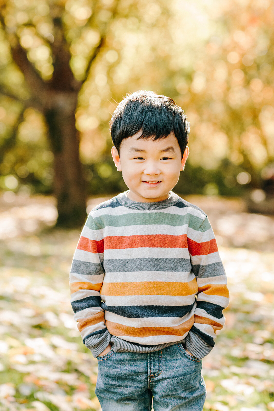 Utah Family Photographer captures young boy wearing a striped shirt during outdoor family photos