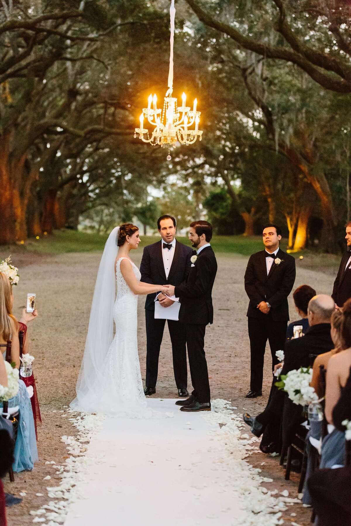 wedding ceremony under giant oaks
