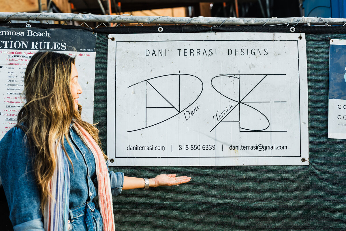 woman-standing-beside-her-business-sign