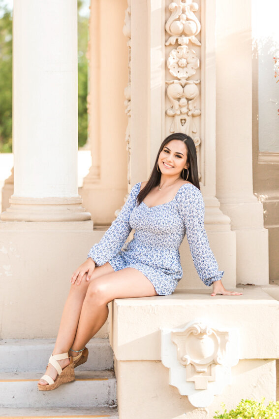 Senior girl sittingn at Balboa Park Organ Pavilion