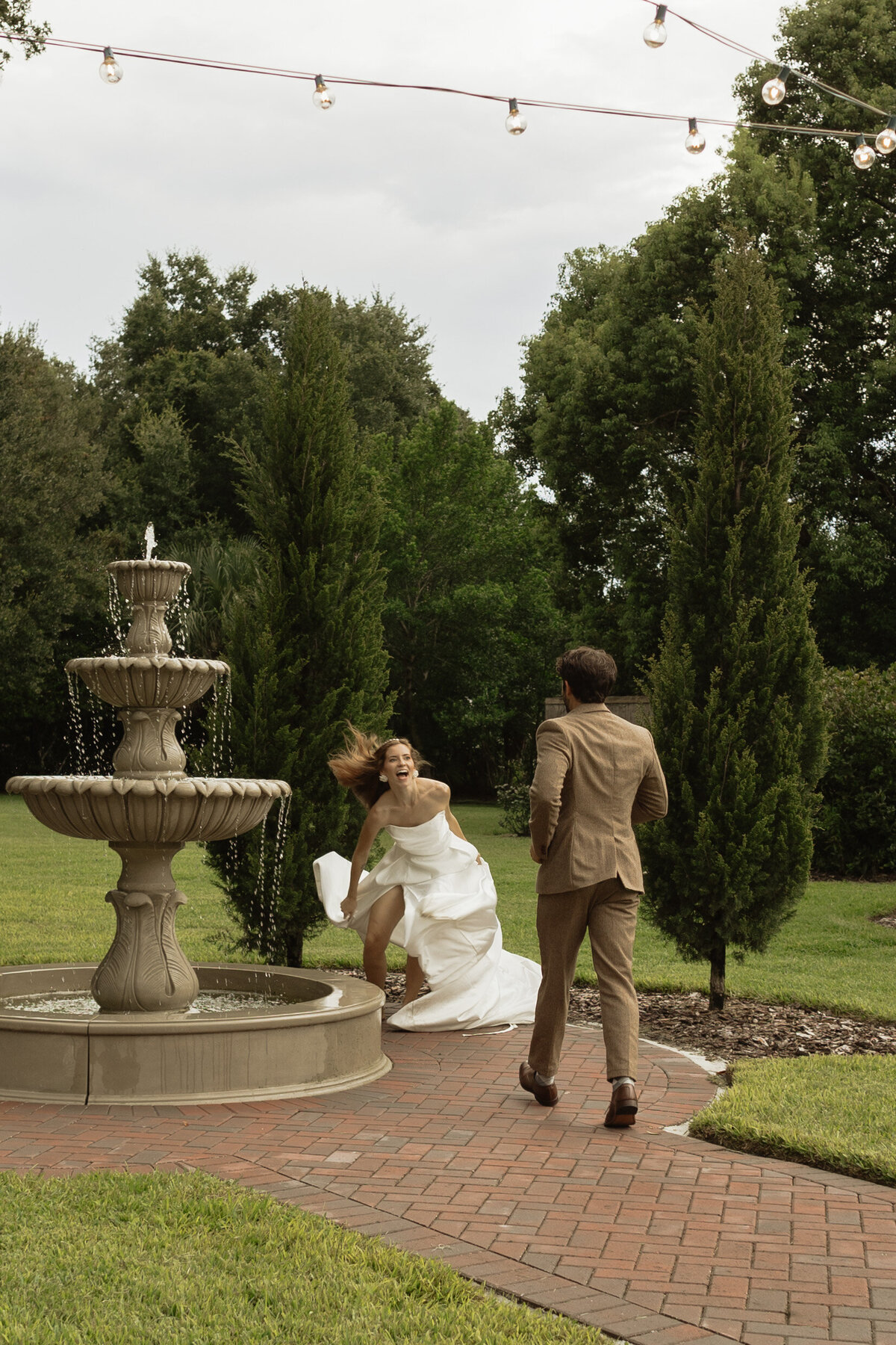Elegant outdoor wedding surrounded by tropical greenery and historic charm at The Palm Mansion