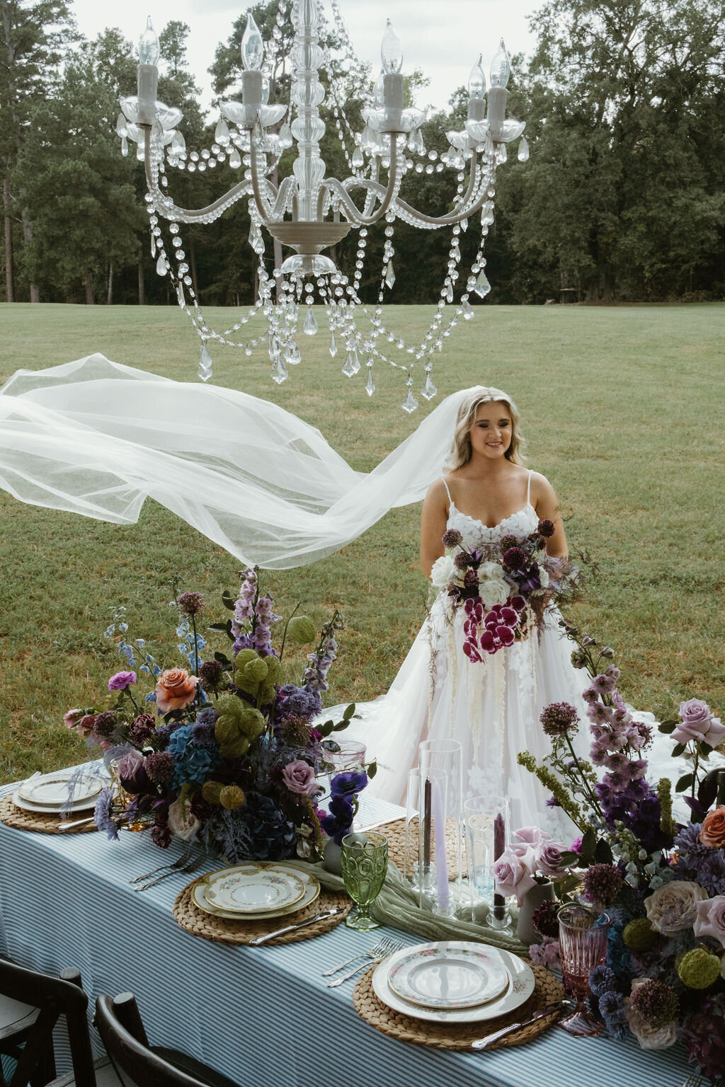 Bride in bridal dress at outdoor reception at The Rosewood Venue in Mount Vernon, TX