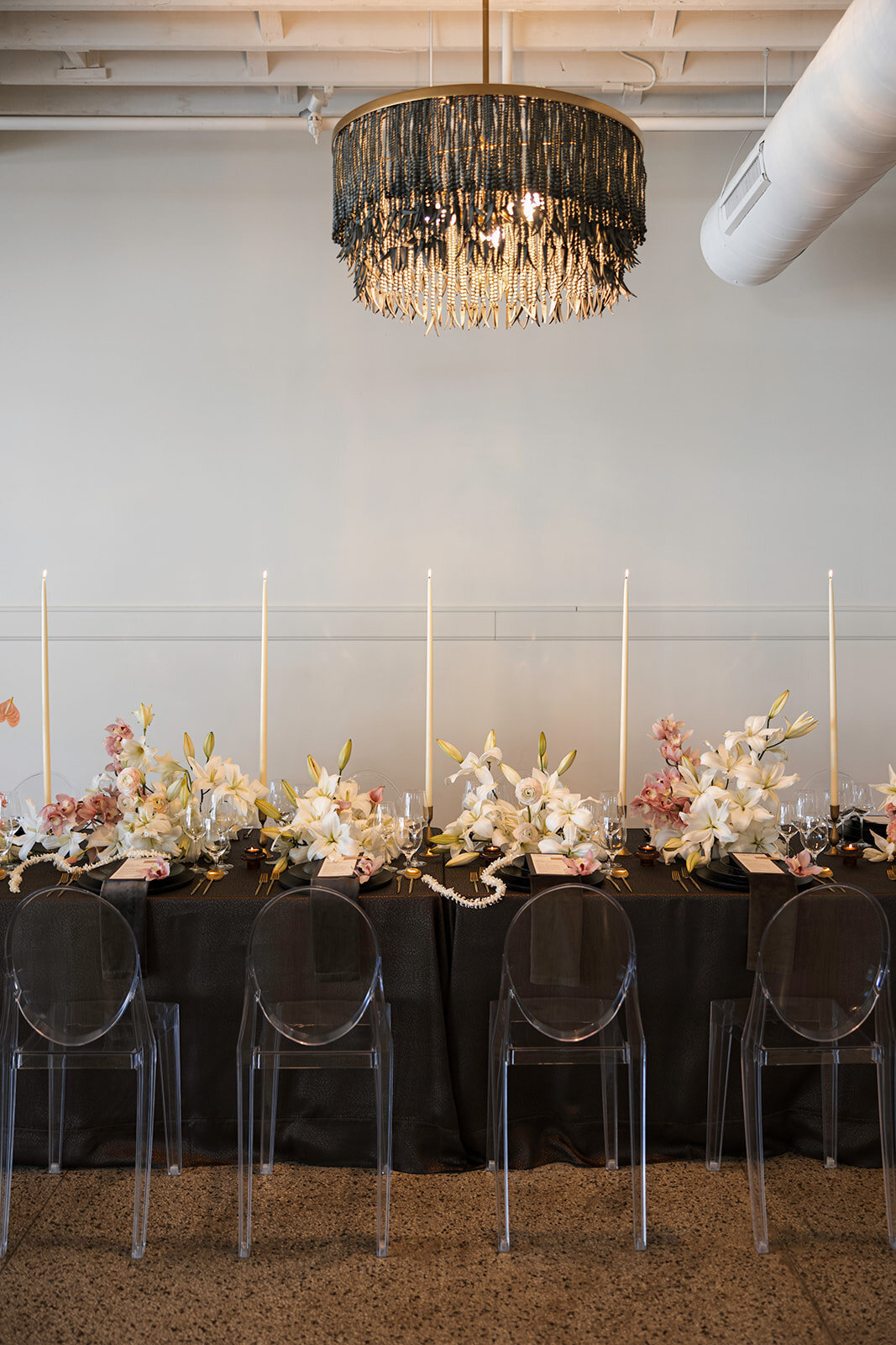 Modern luxe tablescape with florals by M&F Floral & Decor