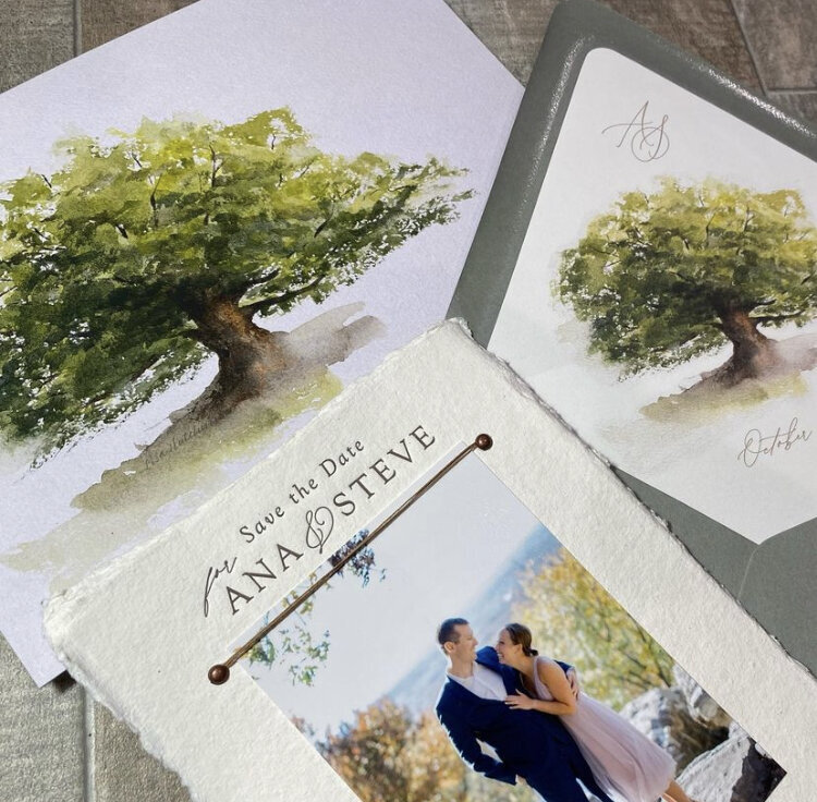 Wedding invitation with custom calligraphy and watermark portrait of a tree