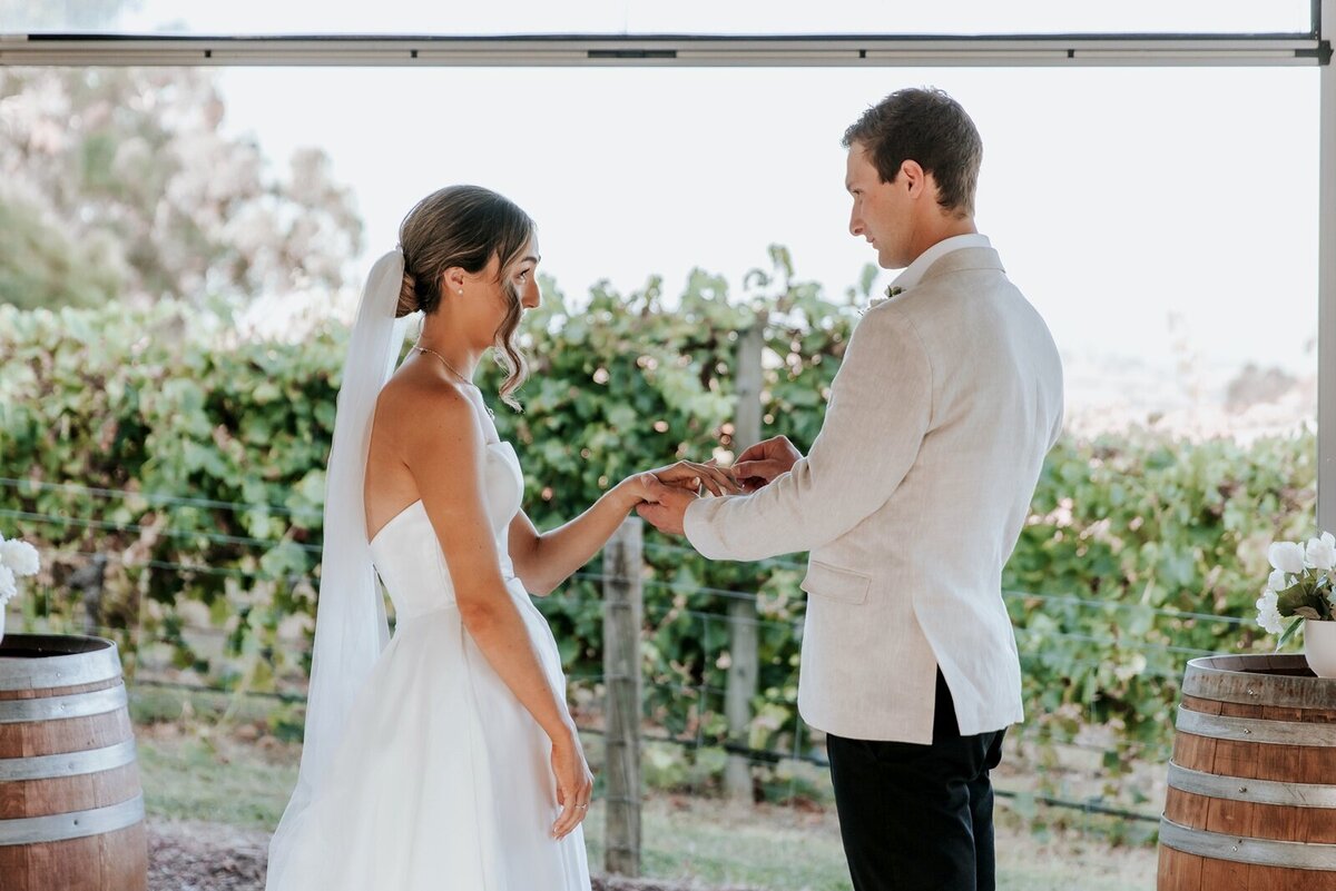 Bride in white dress and groom in beige jacket at their microwedding at Balgownie Estate Yarra Valley