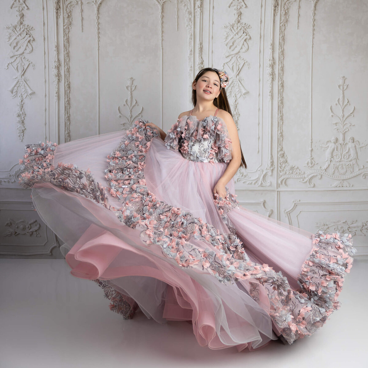 Teen girl twirling in couture gown during styled portrait session near San Antonio
