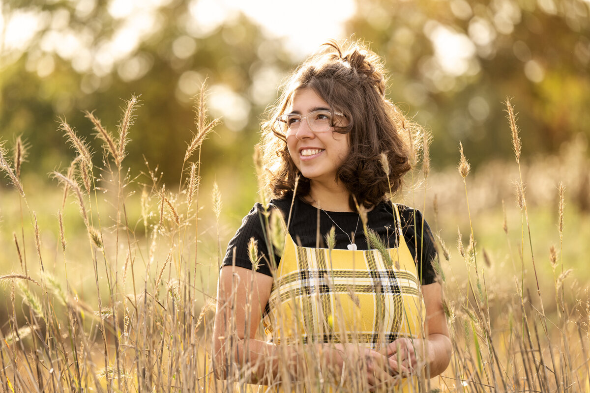 Eagan Minnesota high school senior  in field  of long grass