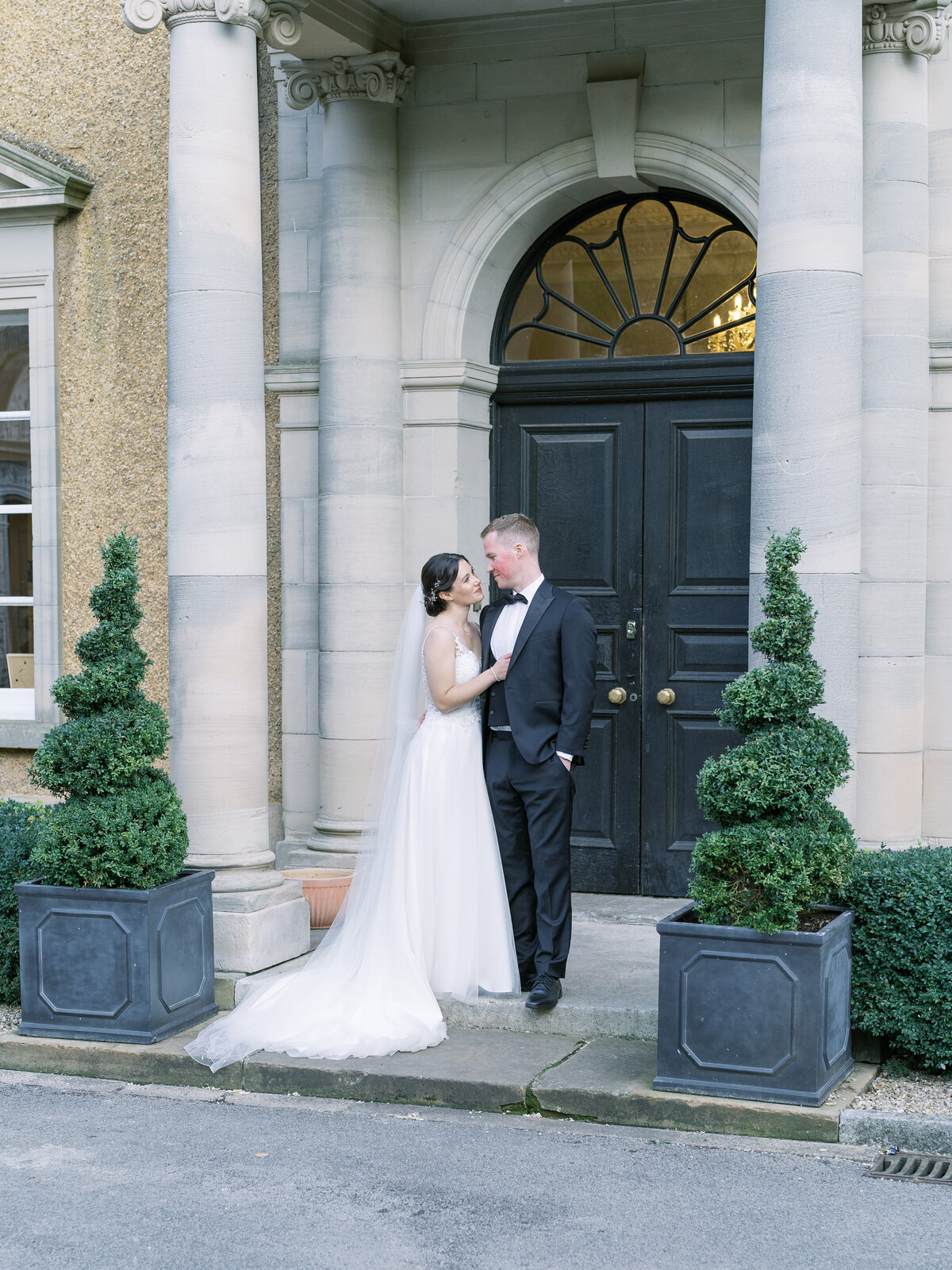 Bride and groom outside country house wedding venue Bourton Hall