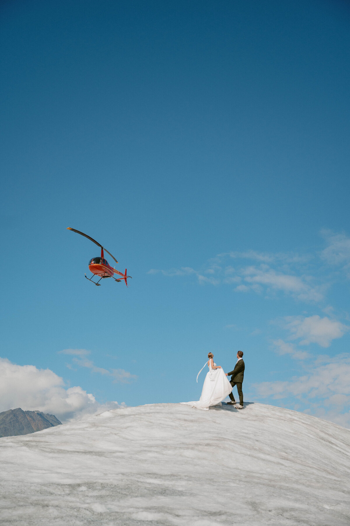 Helicopter fly over couple