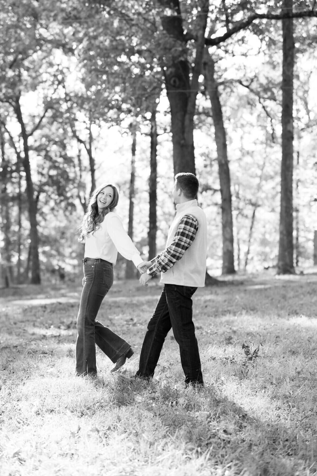 couple walking together by engagement photographers in nashville tn