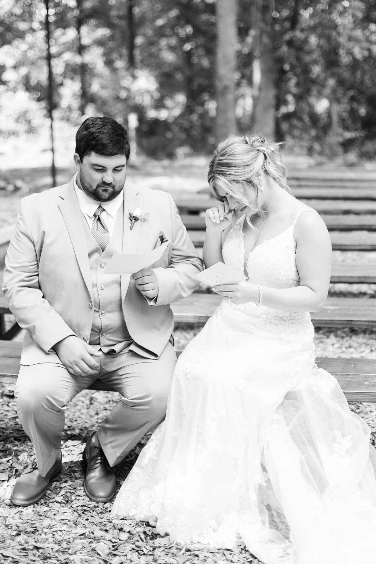 Bride and groom reading notes to each other at  The Barn at White Oaks, Murray, Kentucky