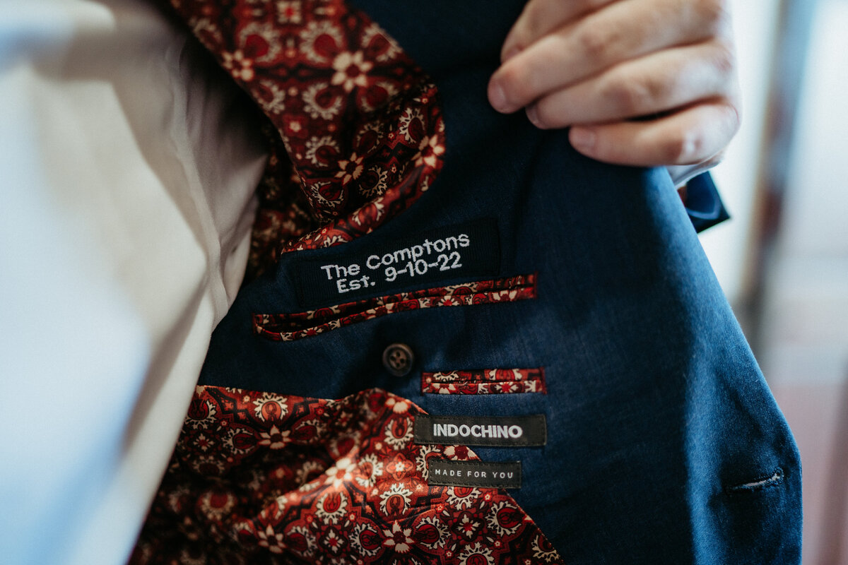 Custom embroidery inside the groom's jacket.