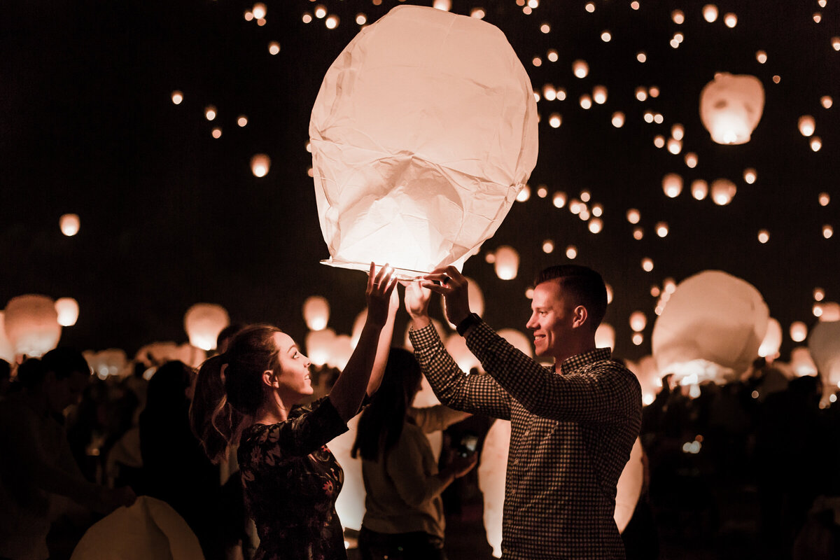 couple lighting a lantern at lantern festival