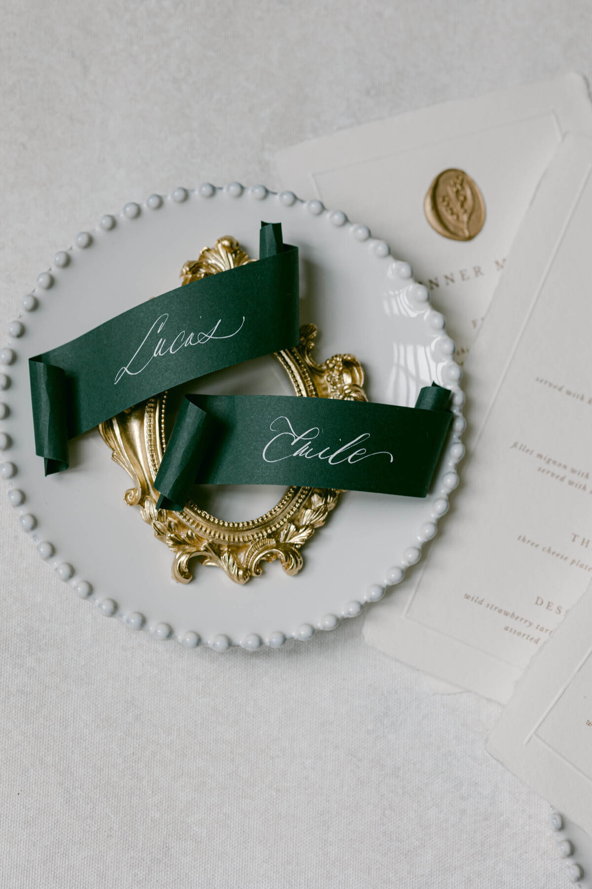 A wedding photo of the name displays on the dinner tables at Chateau de Jalesnes in France.