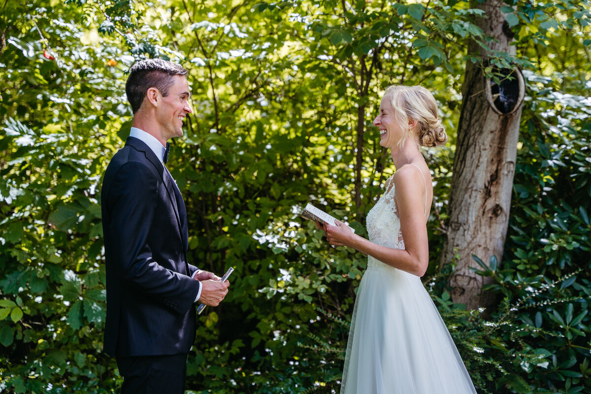 Close-up of bride holding vow book during ceremony