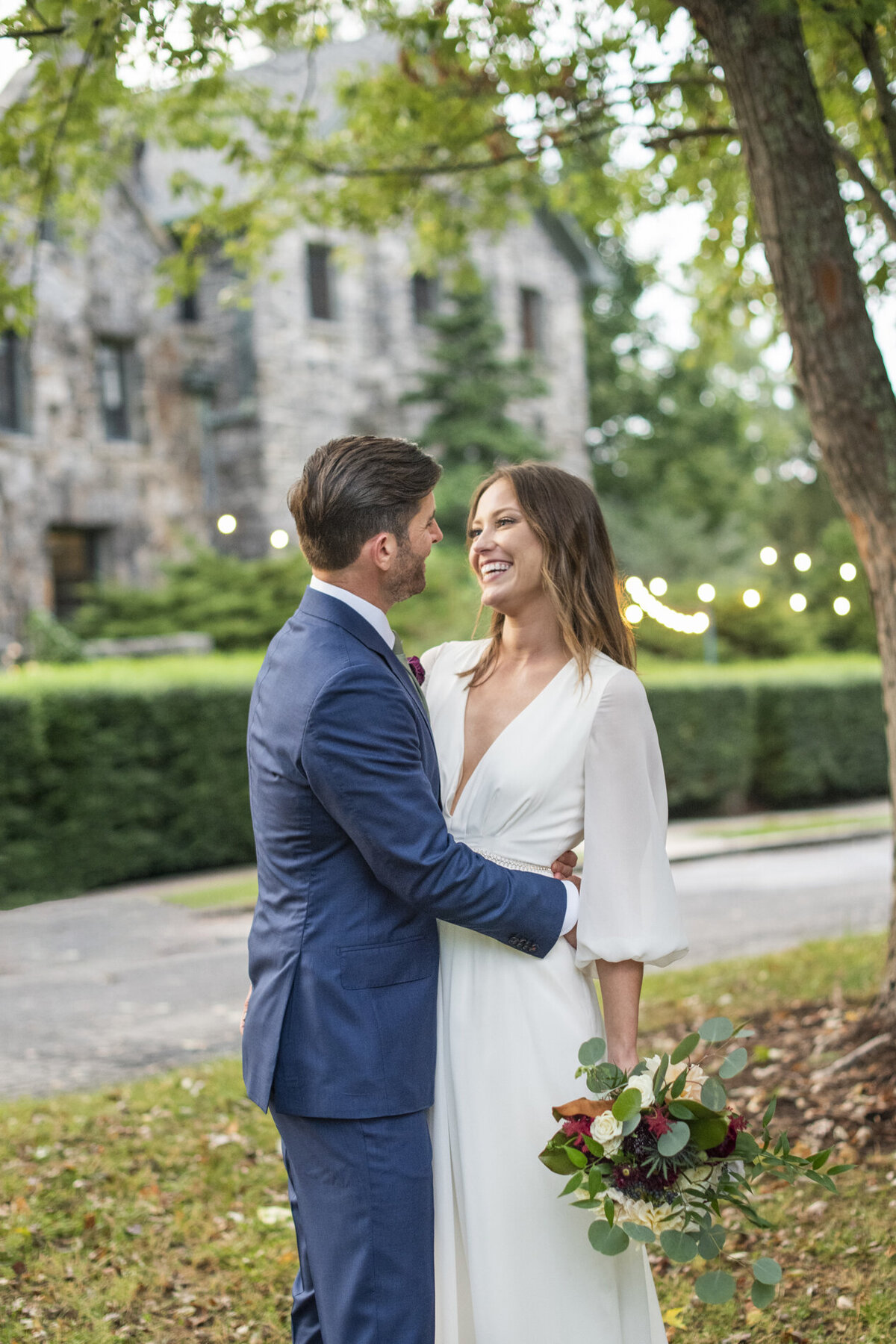 Couple laughing during wedding photos at Homewood Asheville