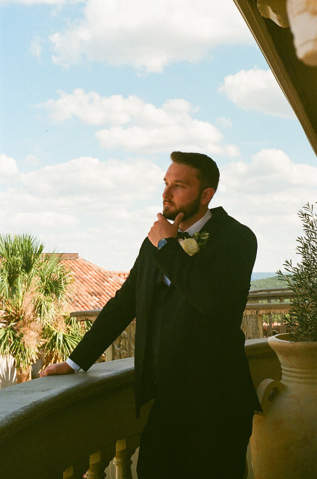 groom portraits on his suites balcony