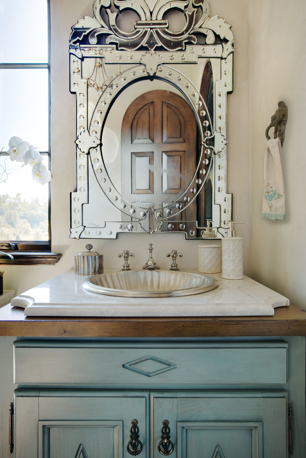 Panageries Residential Interior Design | Italian Country Villa Powder Bath Vanity with Charming Sink, Hardware, and Mirror Details