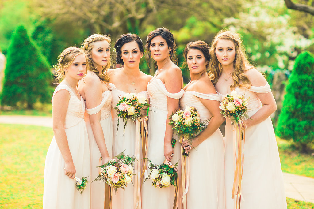 Wedding Photograph Of Bridesmaids in Peach Dresses Holding Flower Bouquets Los Angeles