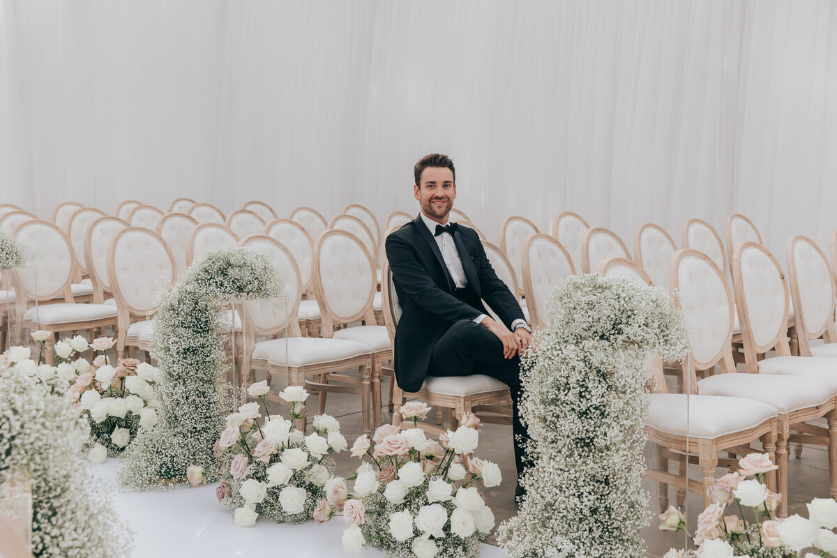 Wedding and floral designer sitting at luxurious reception