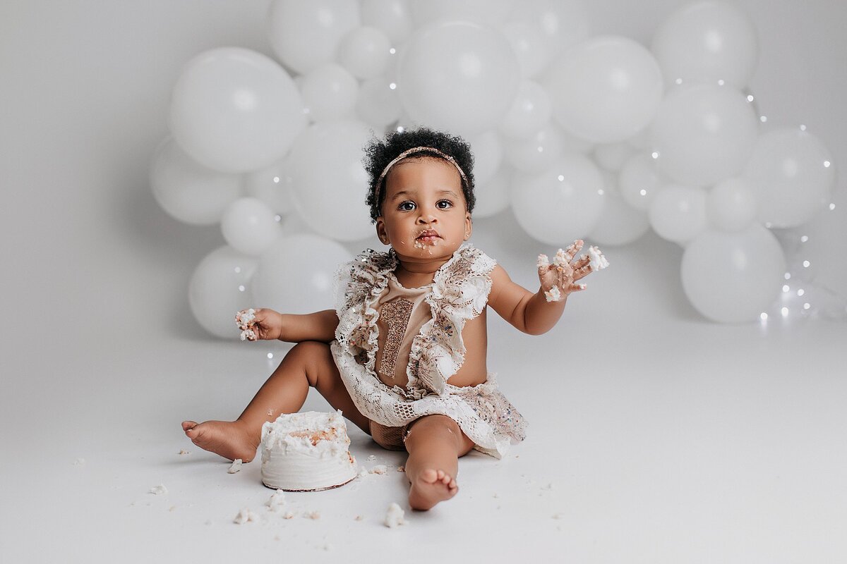 Baby in mini tub bubble bath after messy cake smash session