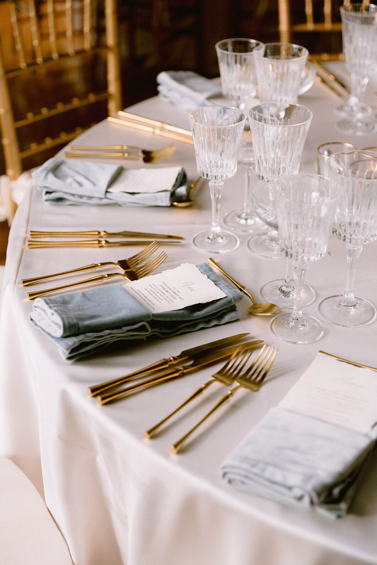 Gold flatware with gray linens at a Newport wedding