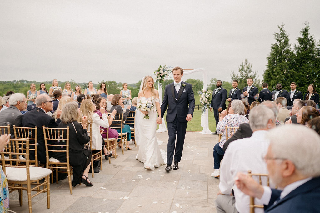 Bride and groom walking down the aisle