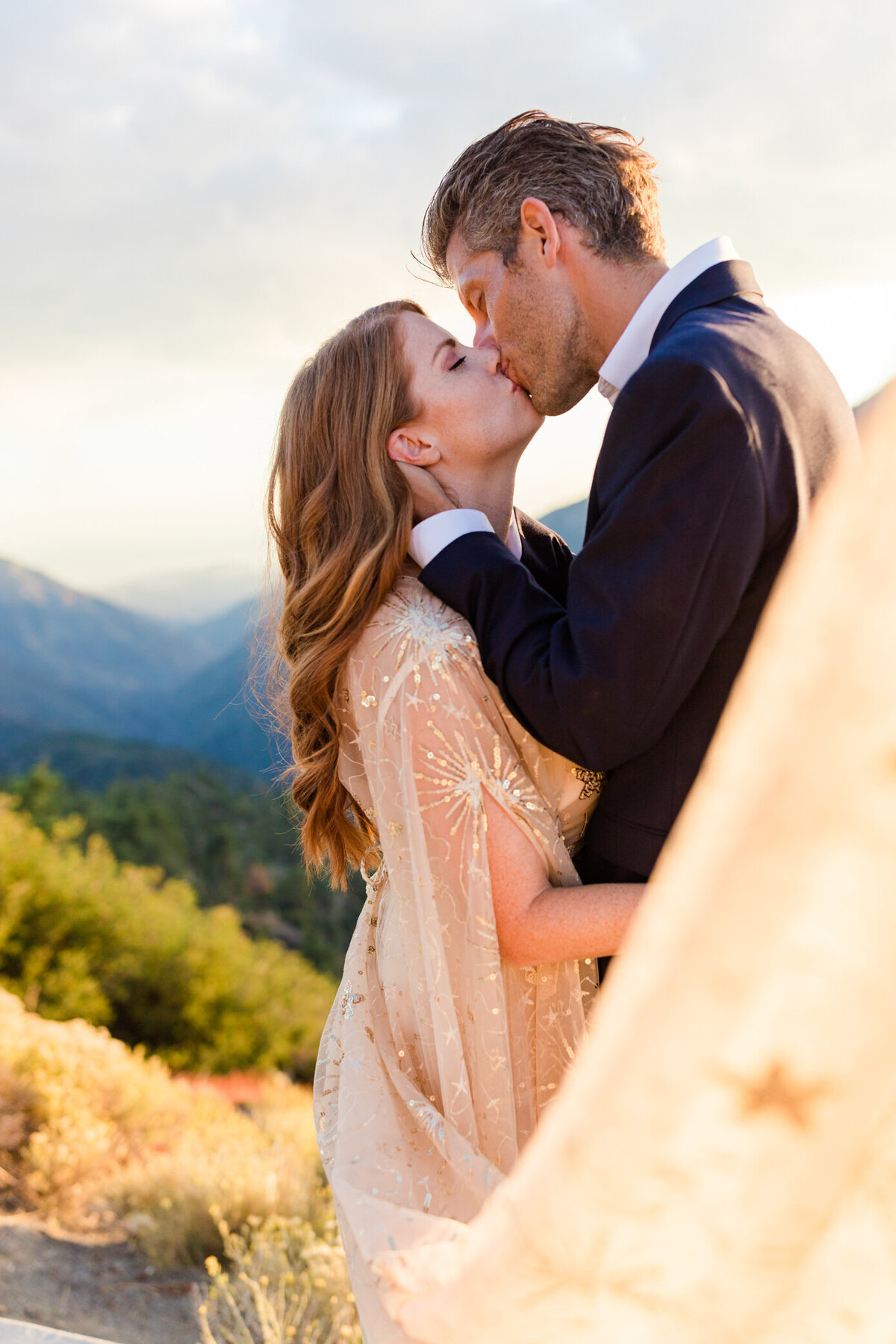 bride anf groom kiss with wedding dress flowing