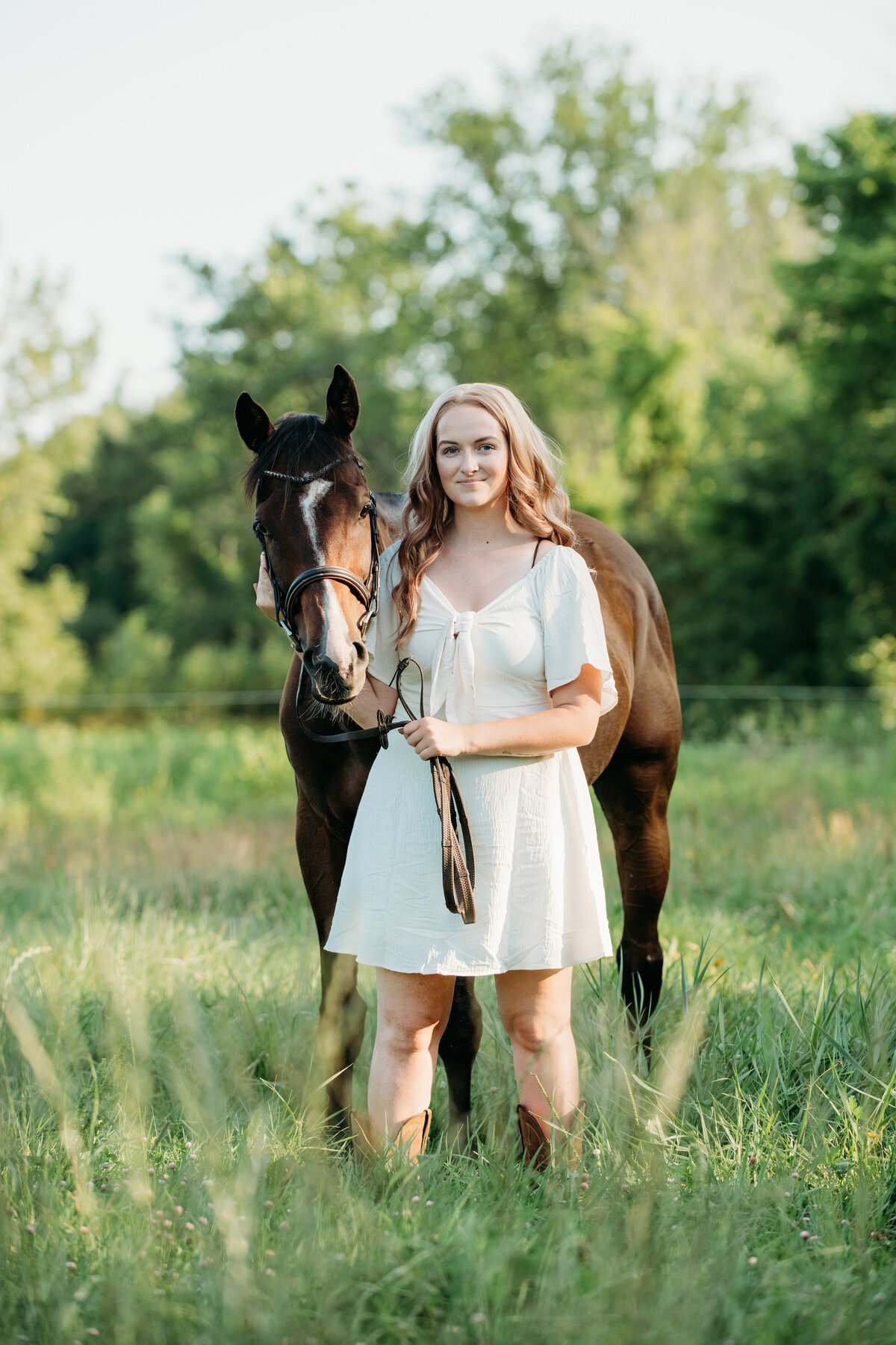Looking for a personalized equestrian portrait session in Rochester, NY? Our expert photographers are passionate about capturing the beauty and spirit of the equestrian world. From dynamic action shots of you riding through scenic landscapes to intimate close-ups of you and your horse, we provide a wide range of portrait styles that reflect the unique bond between rider and horse. Whether in a serene countryside setting or amidst the charming barns of Rochester, NY, our portraits will be a testament to your love of horseback riding. Let us help you preserve these precious moments with our high-quality, custom equestrian portrait sessions.