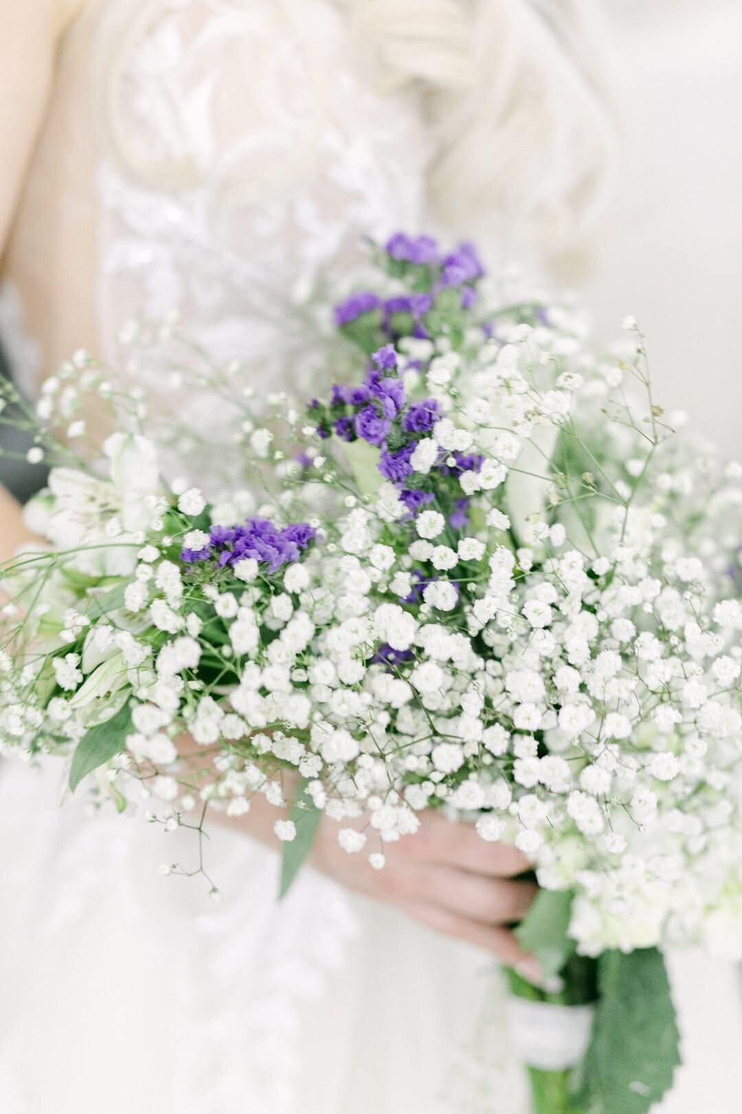 Bride holding a pastel bouquet with soft-focus at New Braunfels Texas Hill Country wedding, photographed by Marina Lazarine Photography.