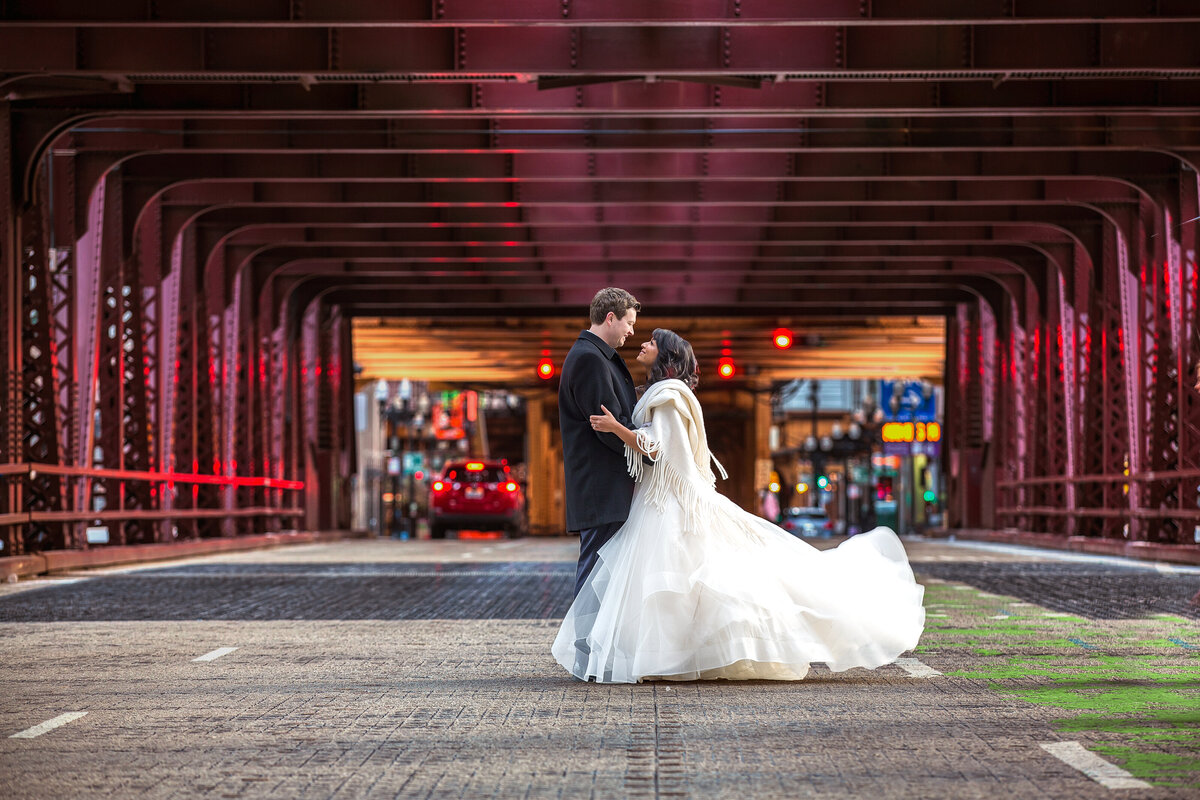 A wedding portrait taken on a Chicago bridge in the cold weather.