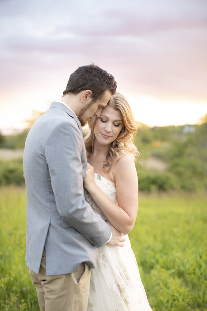 sunset beach engagement portraits in the tall grasses