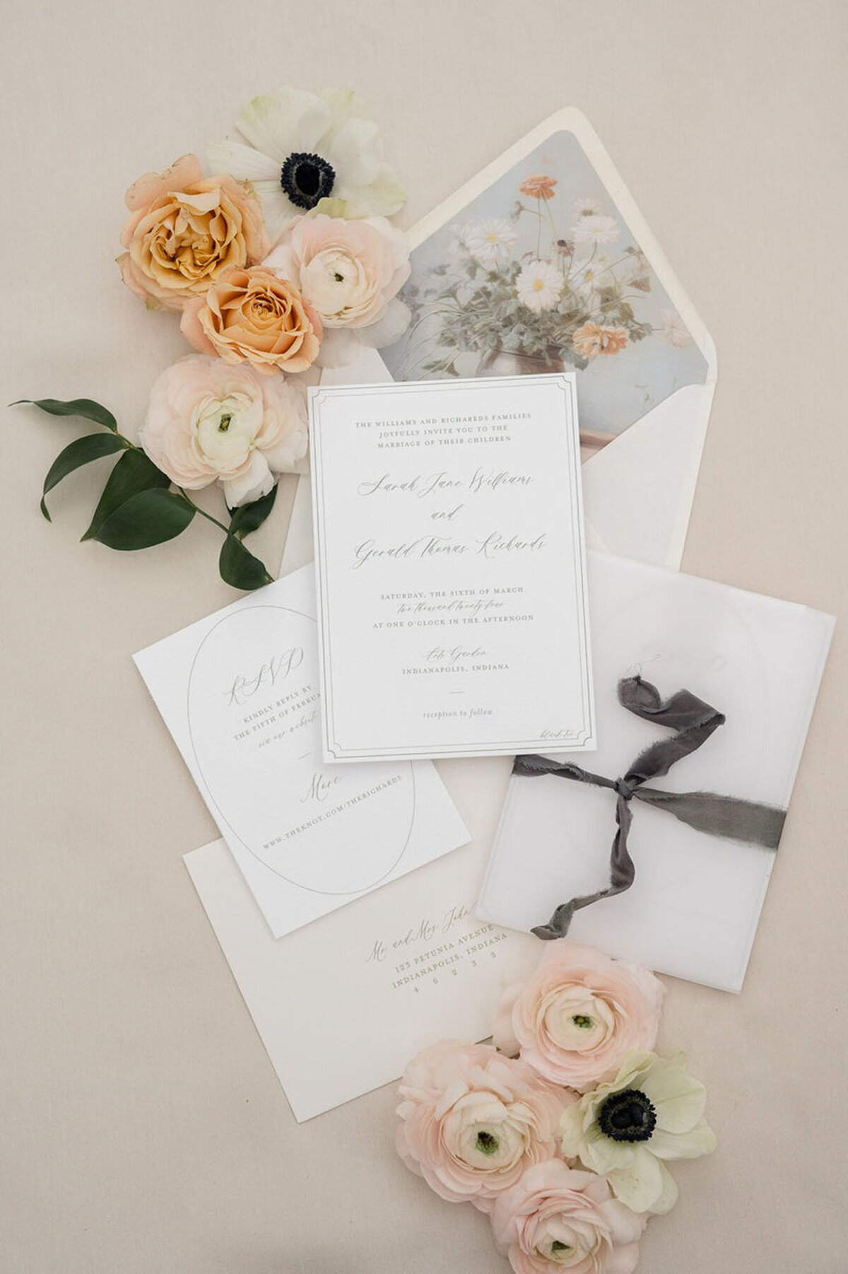 Flatlay with invites and flowers, captured and styled by Detroit, MI wedding photographer​ Courtney Rudicel