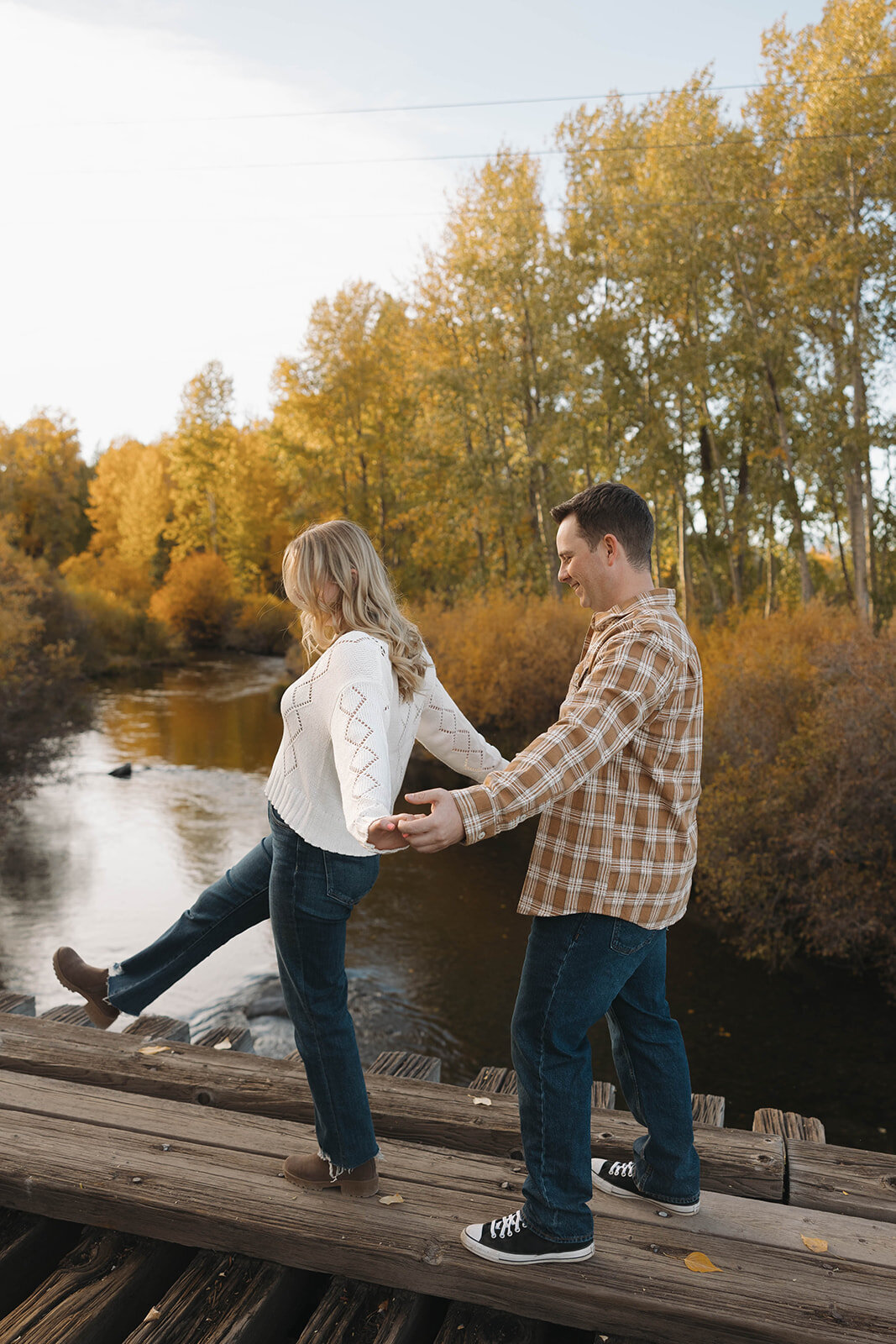 Couple celebrating right after a proposal by the water