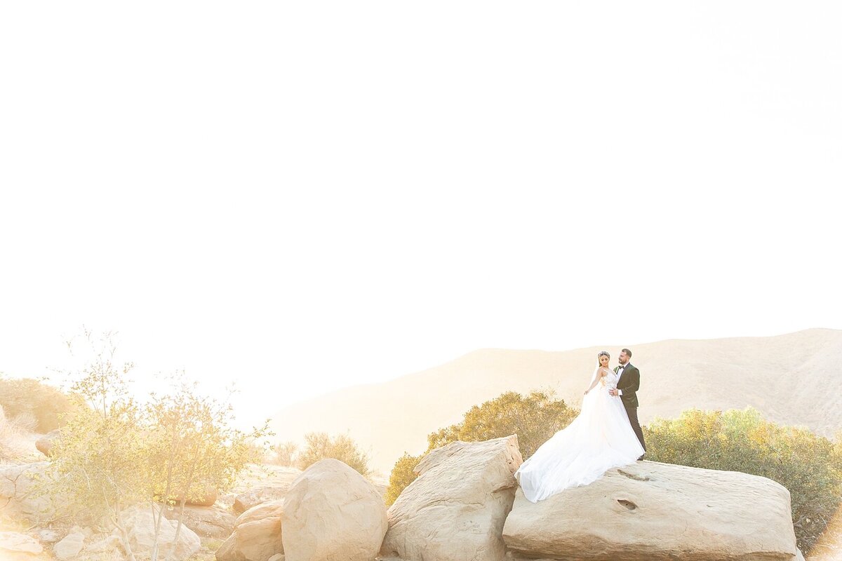 Bride and Groom on mountaintop at Hummingbird Nest Wedding Venue in Santa Susana, California.