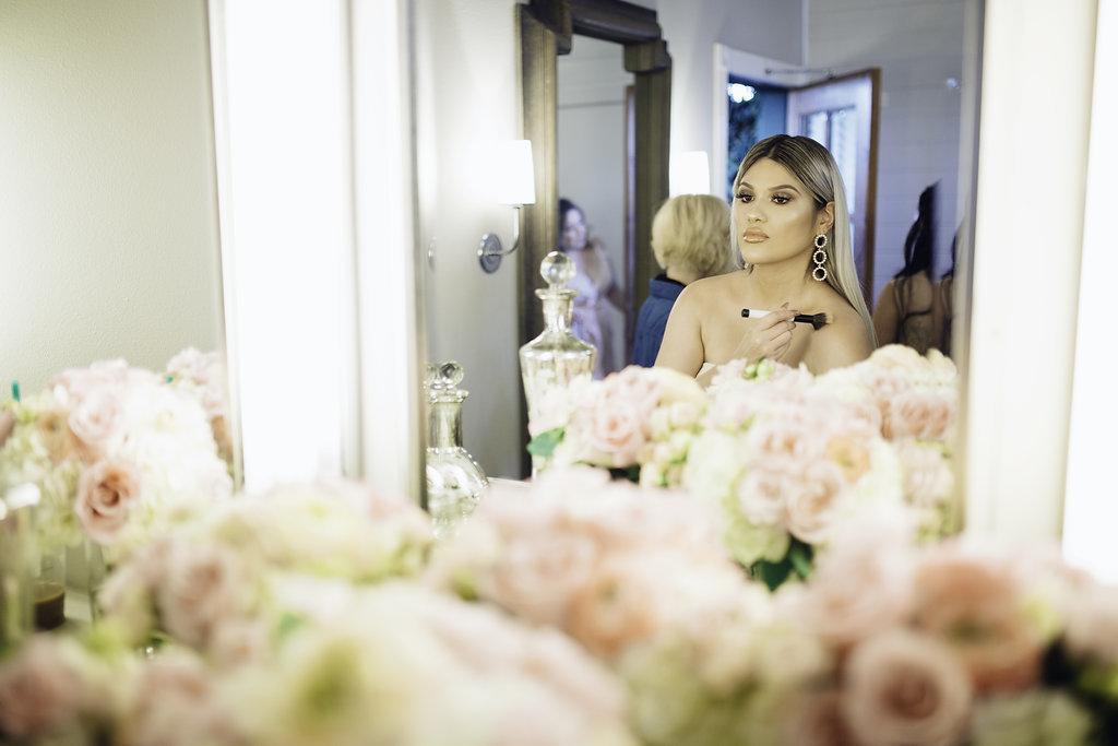 Wedding Photograph Of Woman Doing Her Makeup Los Angeles