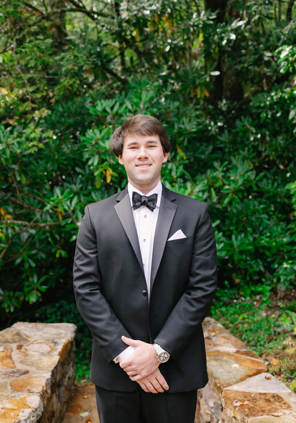 Formal groom portrait in a classic black tux outdoors before his fall wedding at The Bascom Center for the Visual Arts in Highlands NC.
