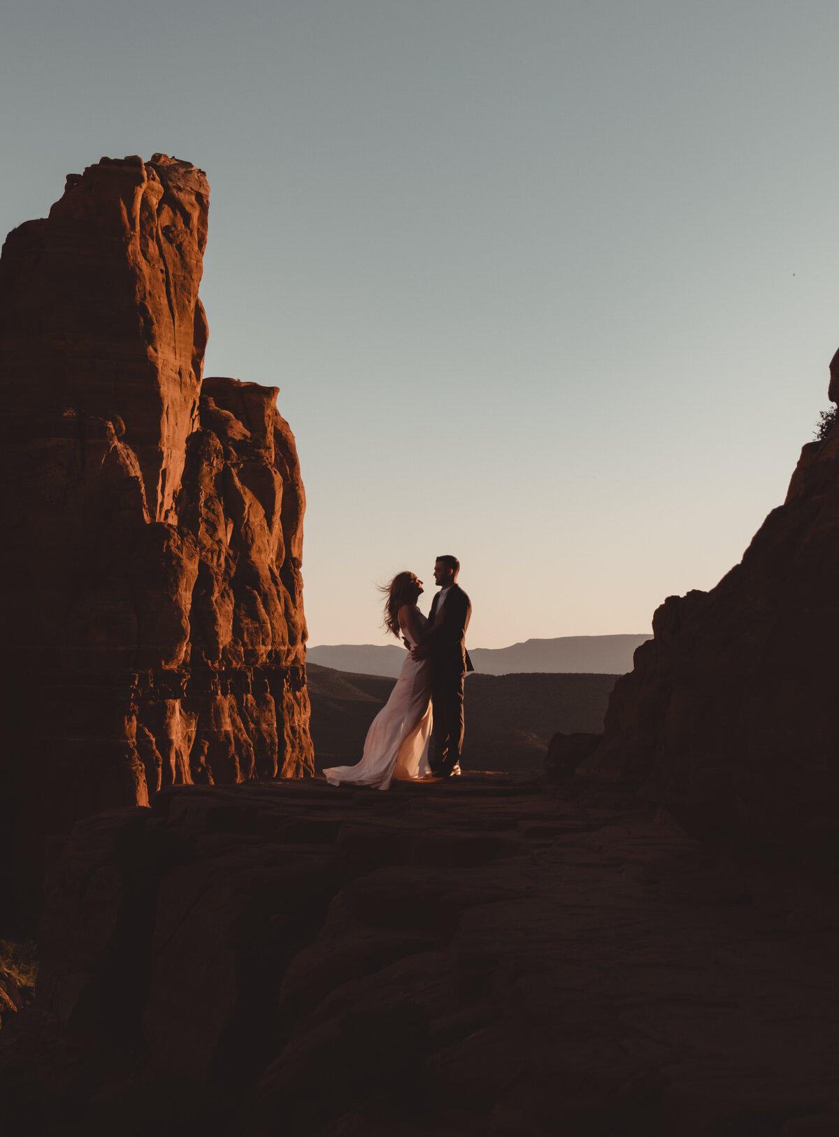 Bride twirling dress in desert light Sedona Cathedral Rock taken by Kollar Photography