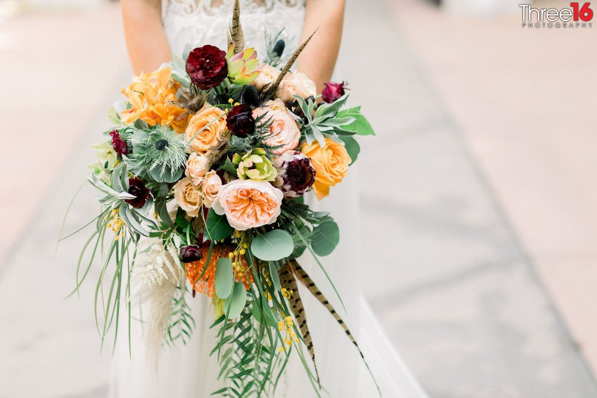 Bride holding her beautiful bouquet of flowers