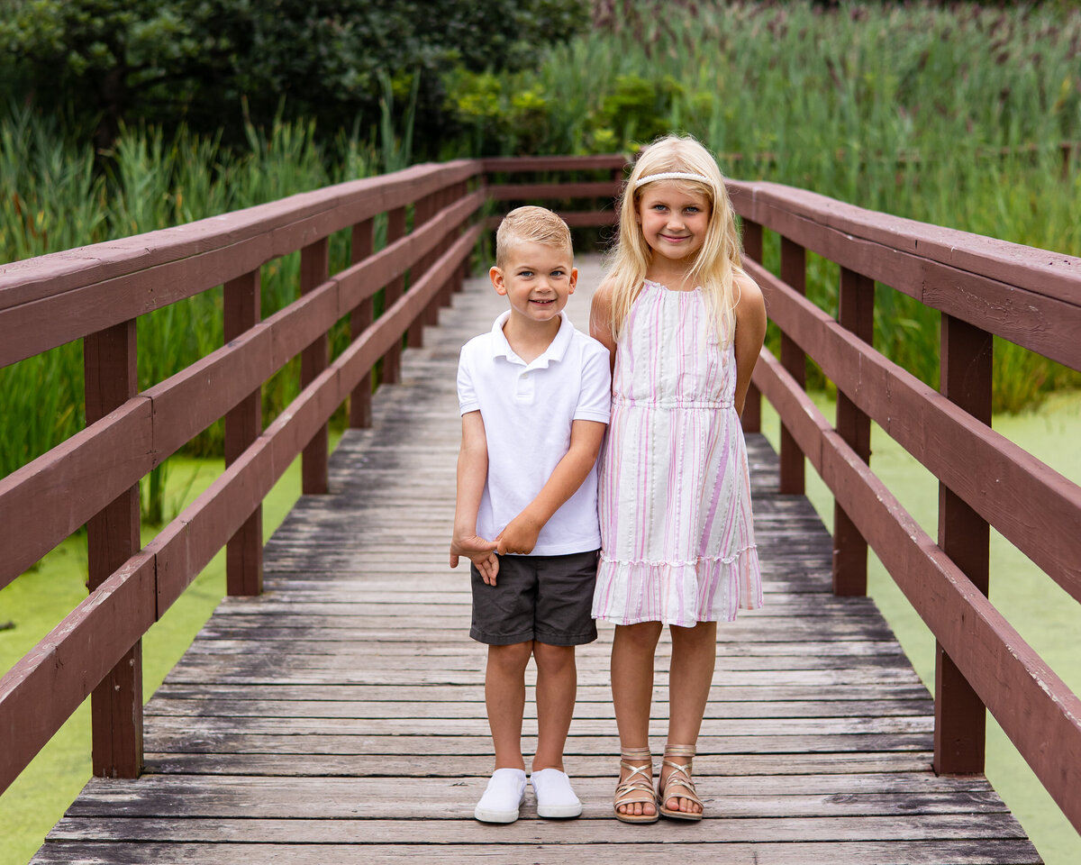 Children posing on the bridge