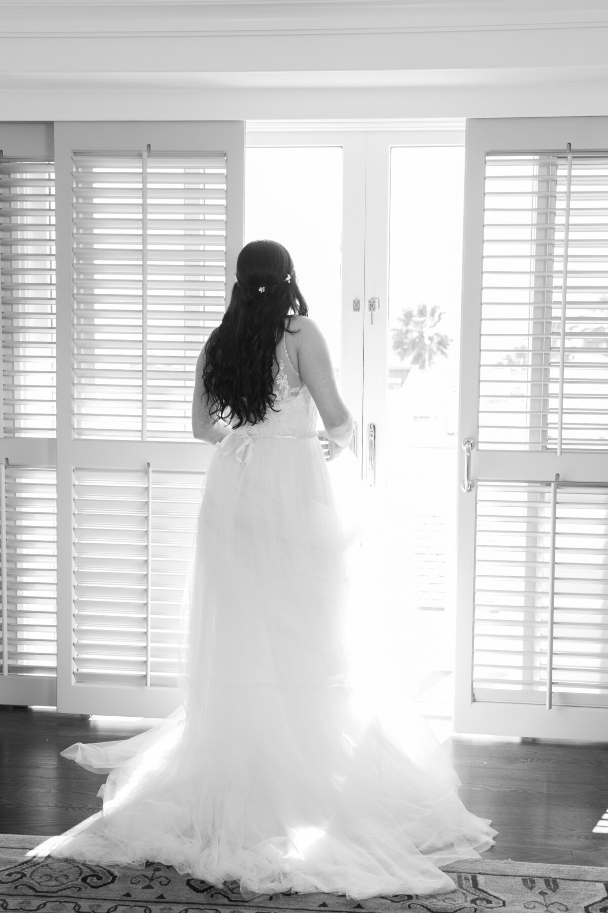 A bride looking out of a window