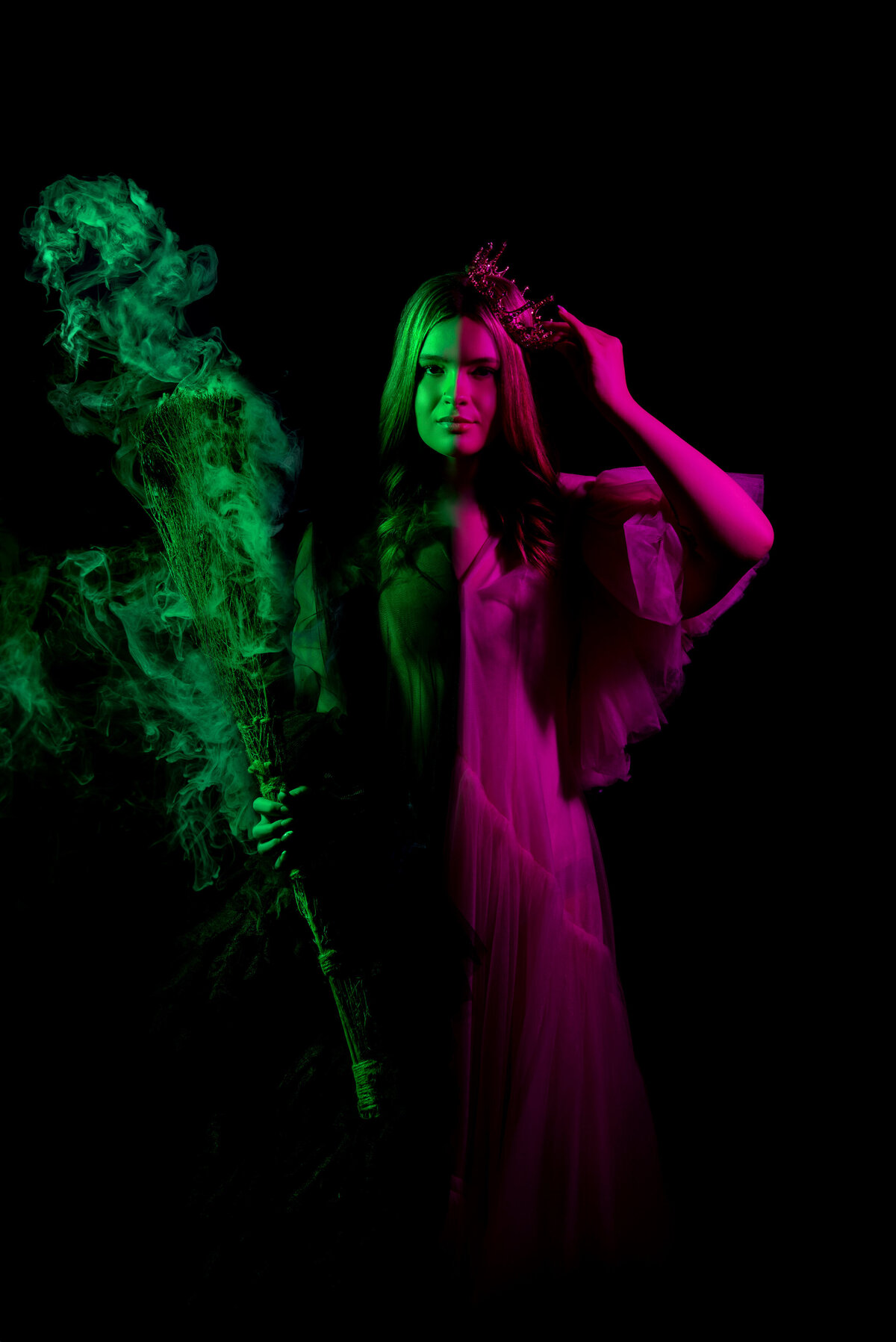 st-louis-senior-photographer-senior-girl-in-two-tone-wicked-light-with-broom-and-green-smoke