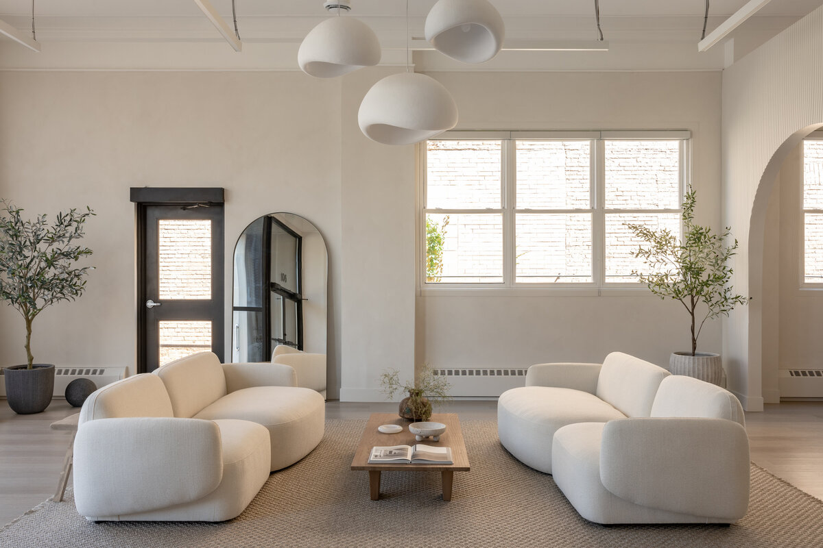 backyard patio with two sofas and accent chairs with coffee table in the center