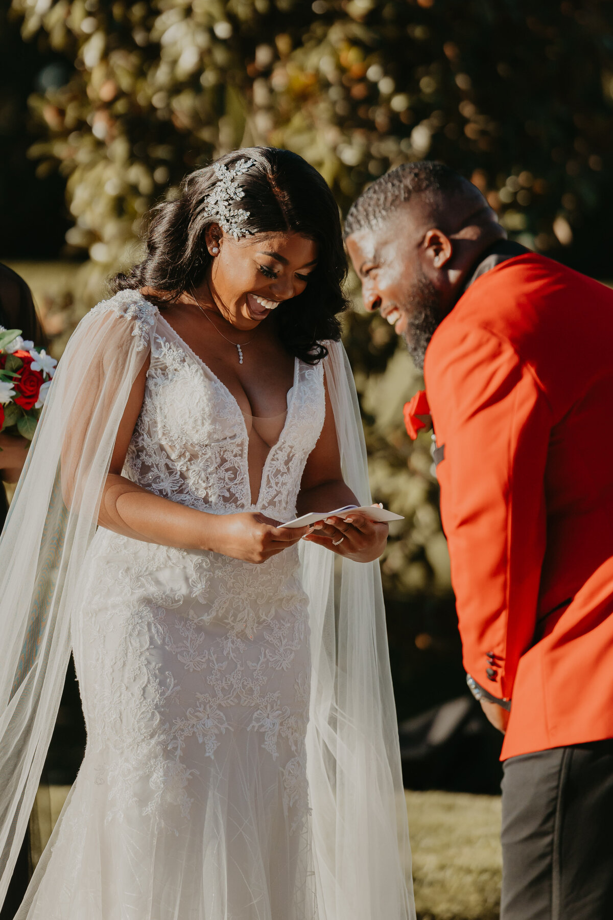 groom laughing at brides vows during ceremony