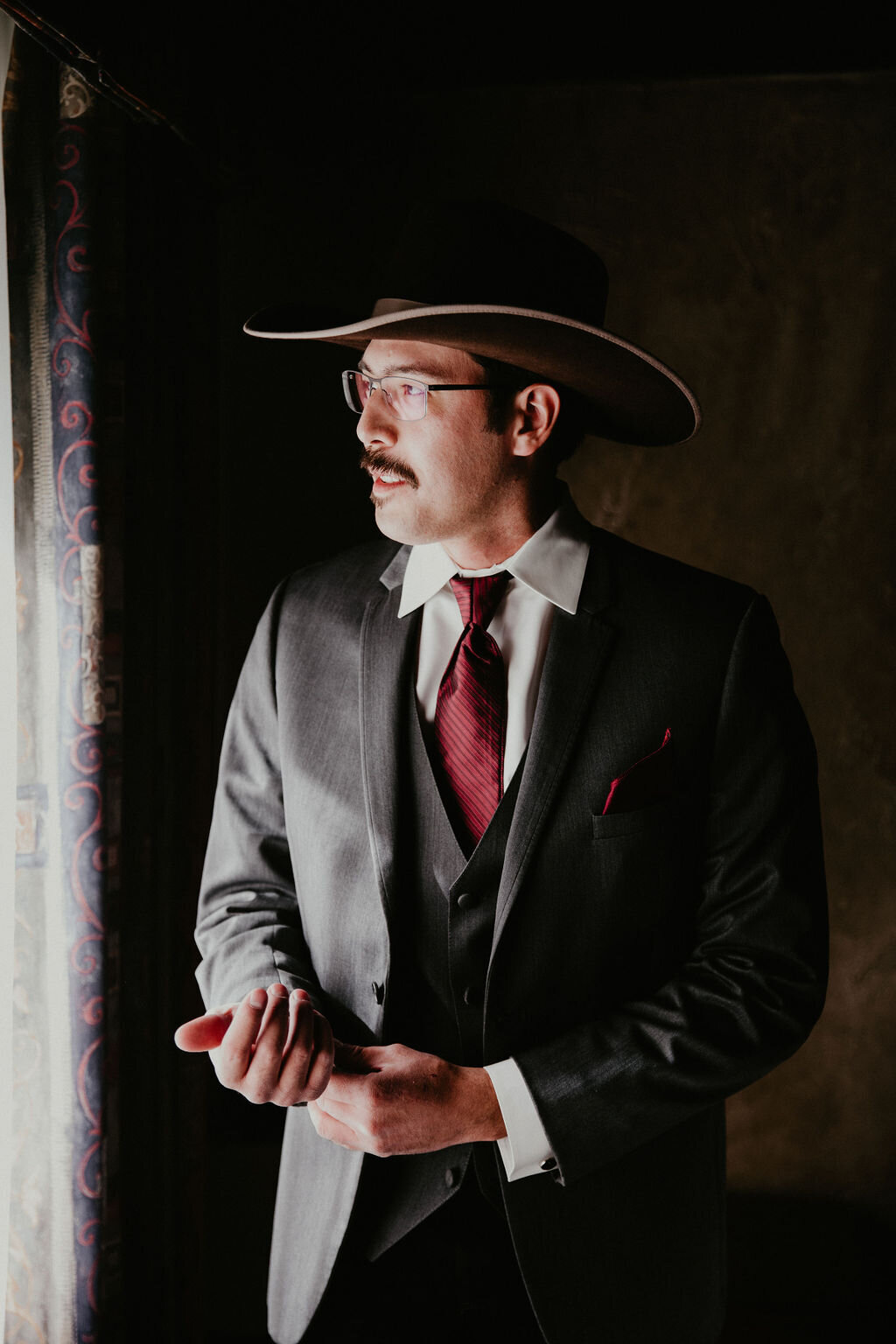 A groom gets ready for the wedding