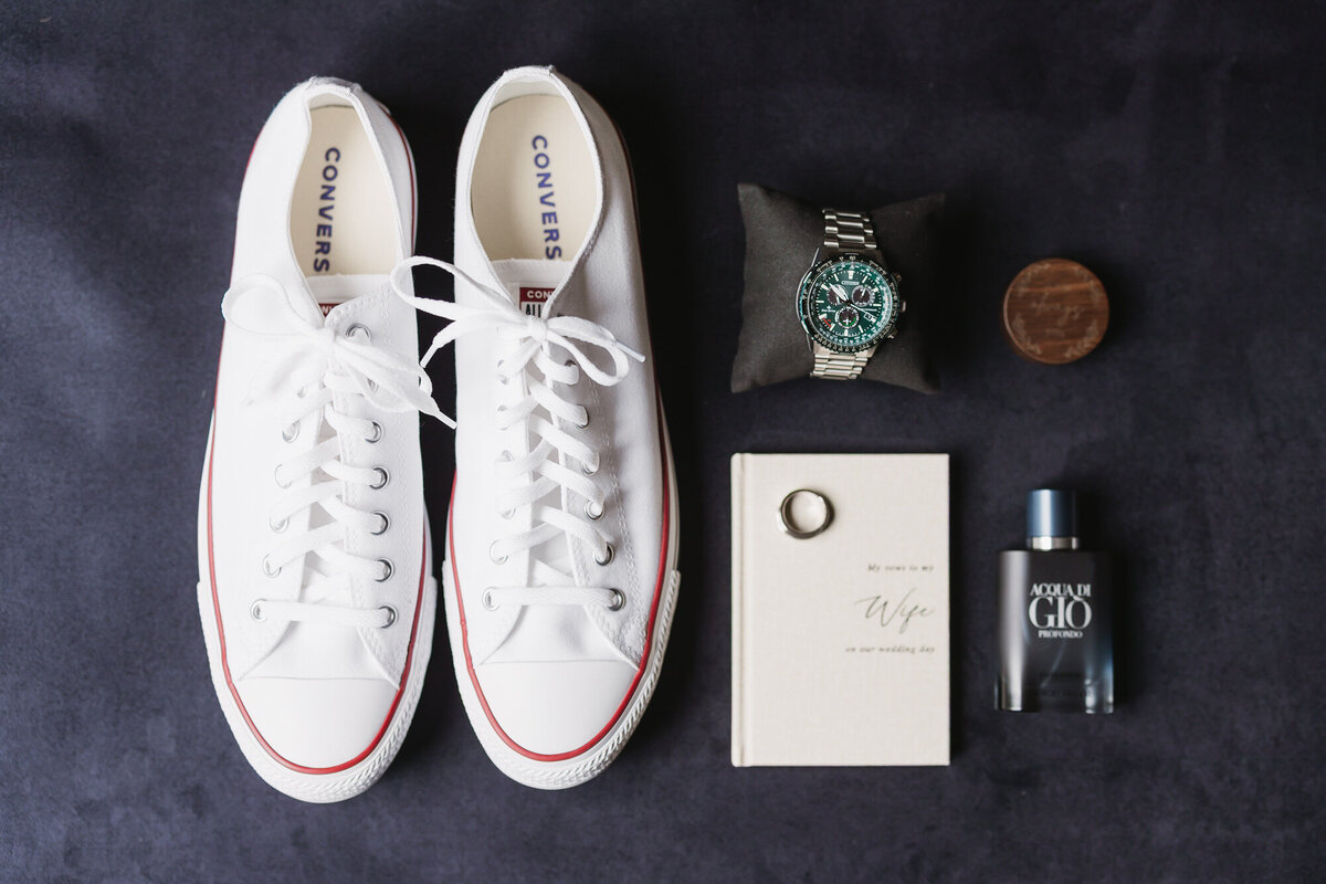 Groom details of shoes, ring, watch and cologne