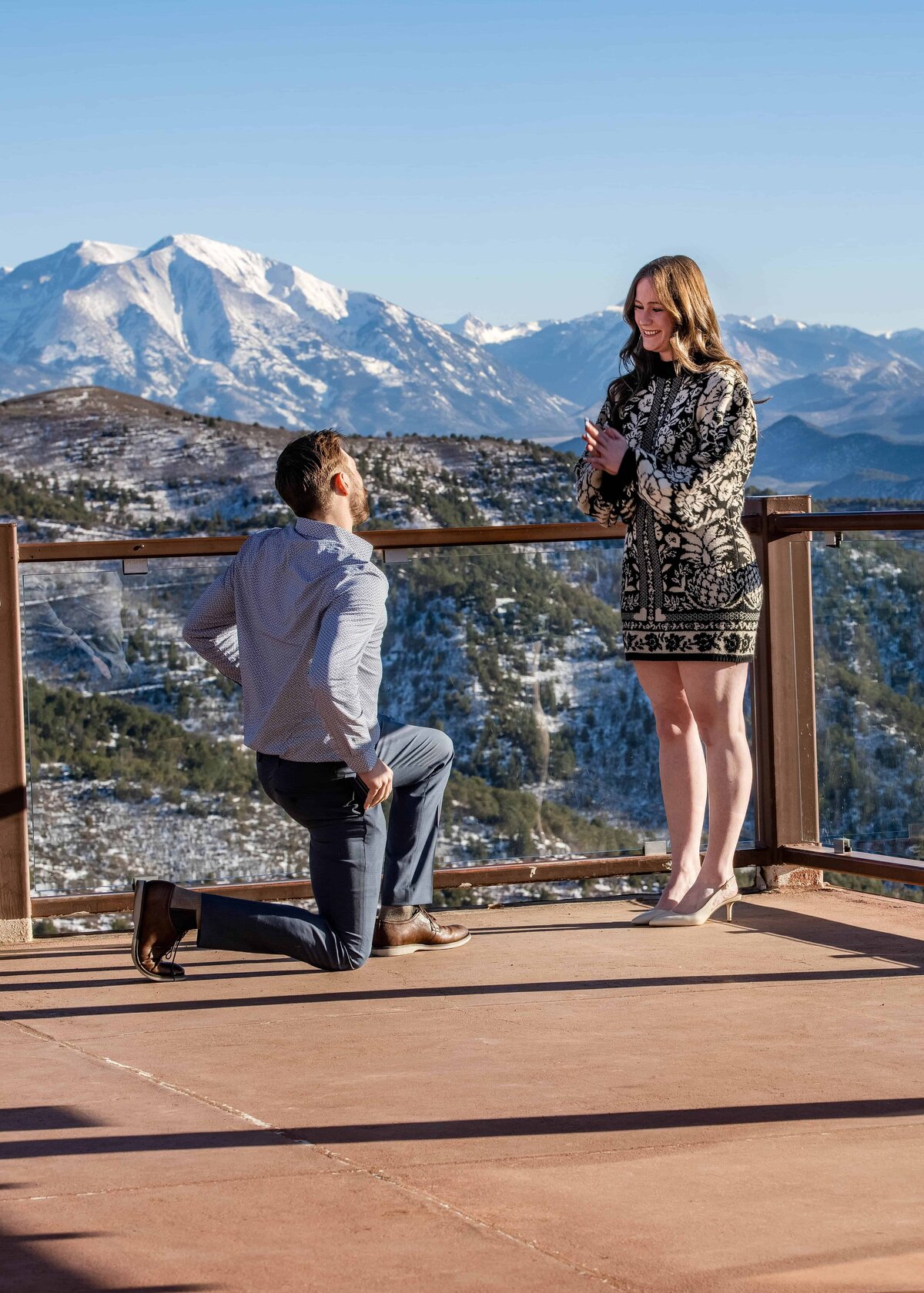 A man on his knees proposing in Glenwood Springs Colorado